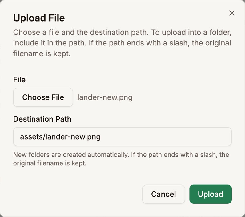 The Upload File dialog with lander-new.png chosen and the destination path assets/lander-new.png